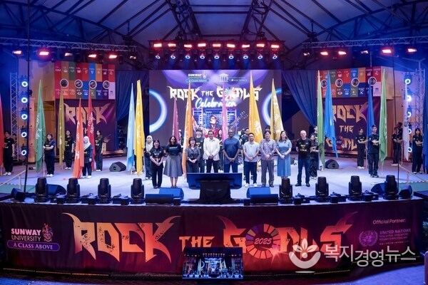 Distinguished guests and ambassadors on stage with the 17 SDG flags to commemorate the 10th anniversary of the launch of UN SDGs.